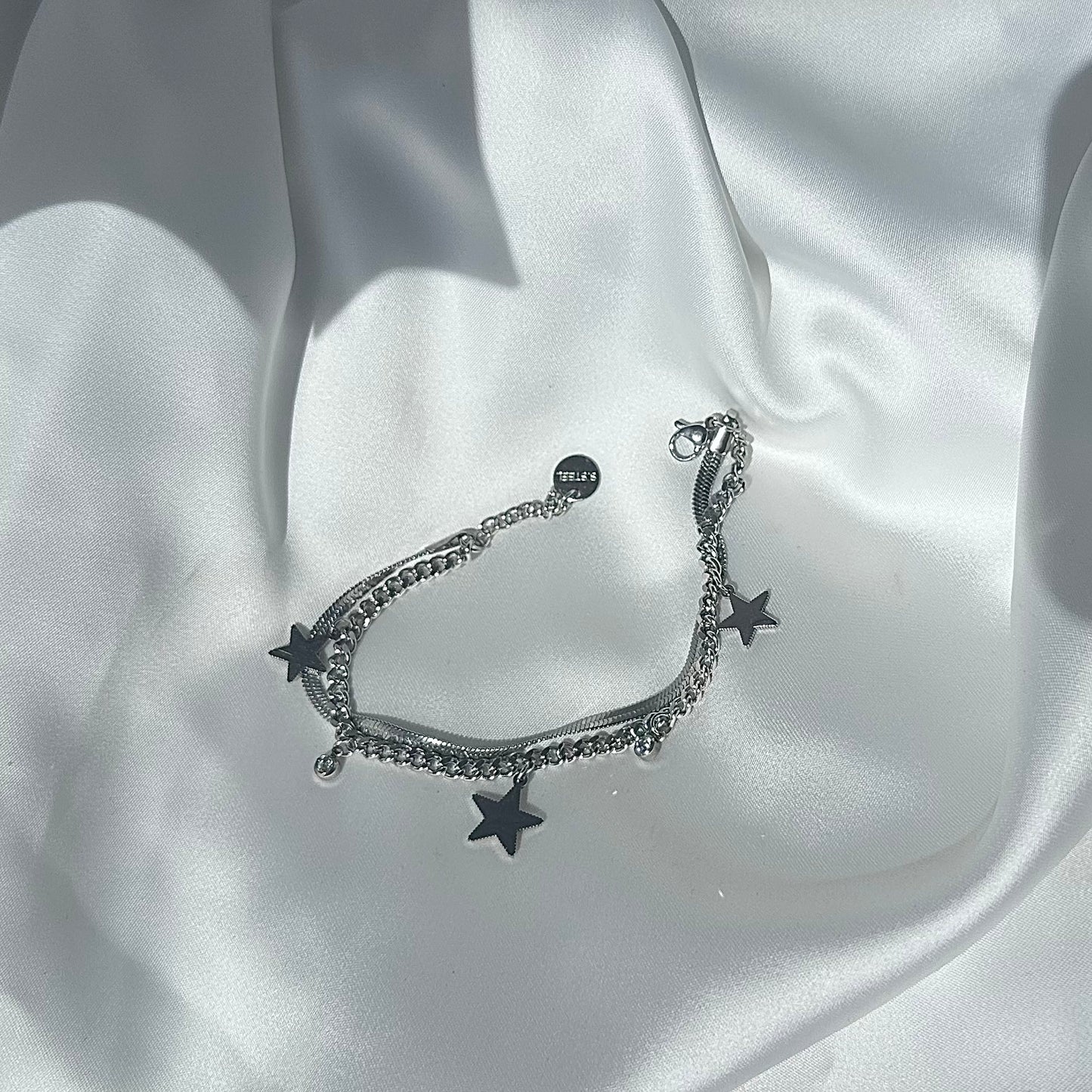 Bracciale “Stella d’Argento” – Acciaio Placcato con Charme e Punto Luce