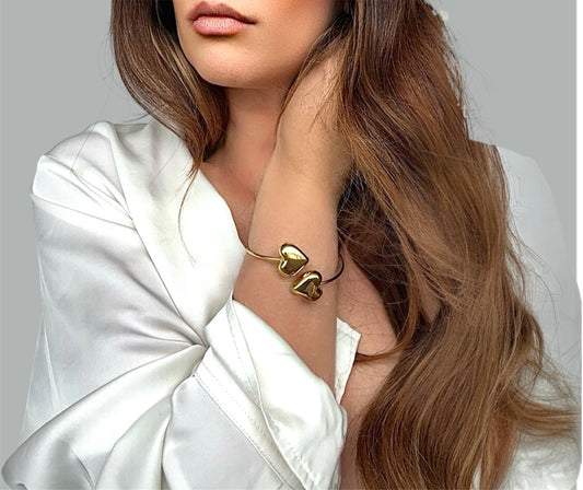 Bracciale rigido con 2 cuori placcati in oro acciaio inossidabile