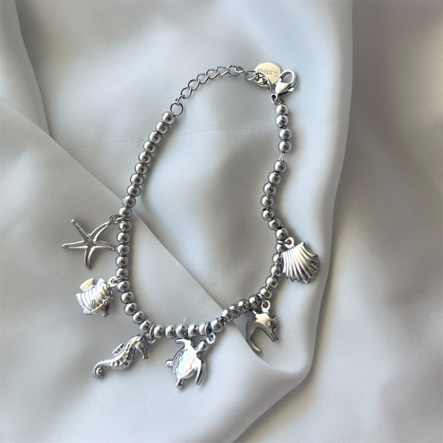 Bracciale in acciaio con sfere di 6 mm e ciondoli Marini sonaglio