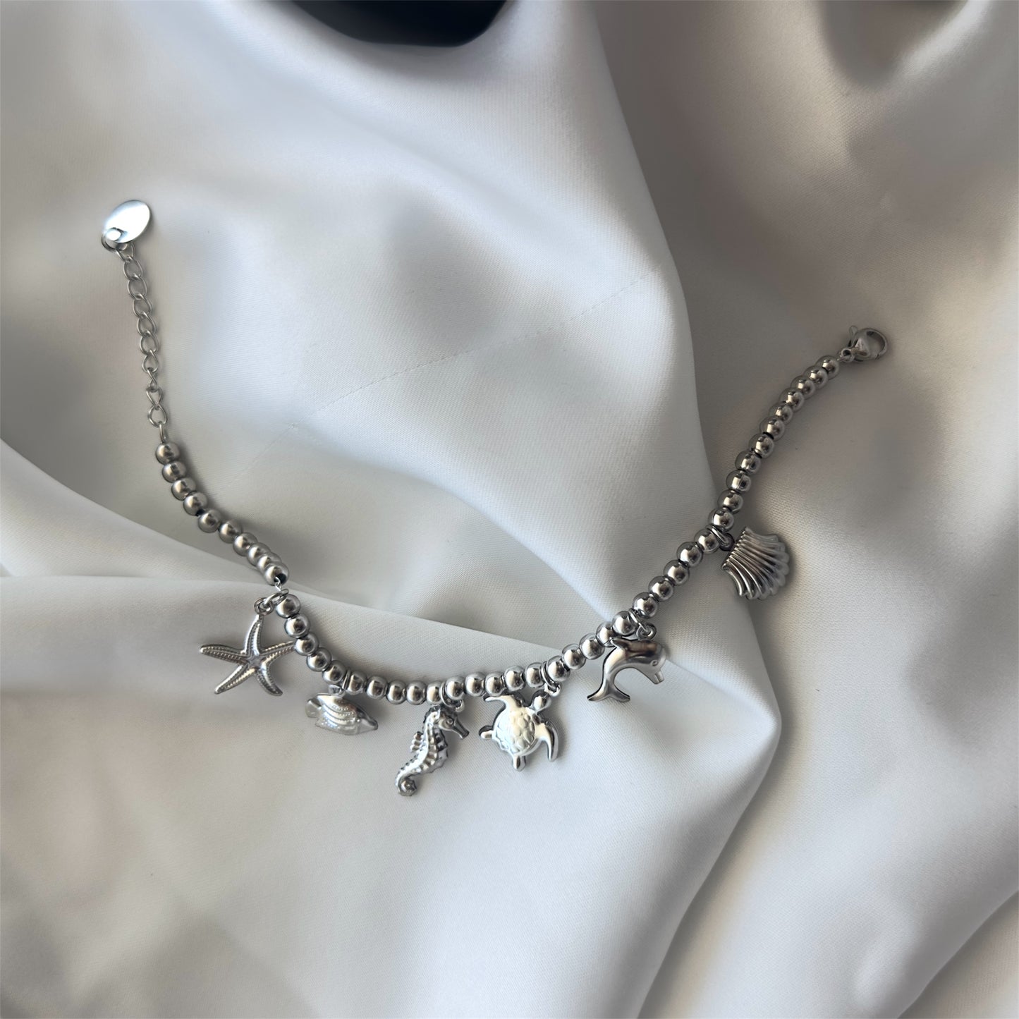 Bracciale in acciaio con sfere di 6 mm e ciondoli Marini sonaglio