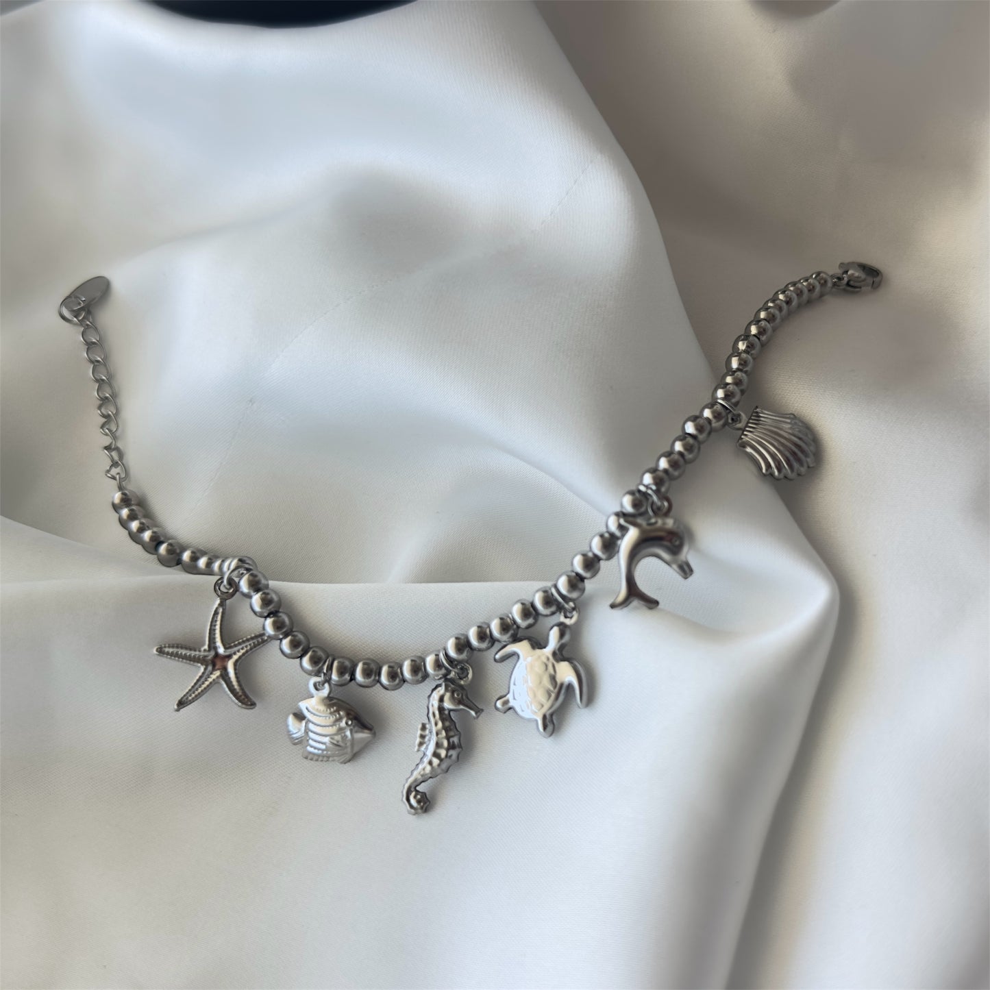 Bracciale in acciaio con sfere di 6 mm e ciondoli Marini sonaglio