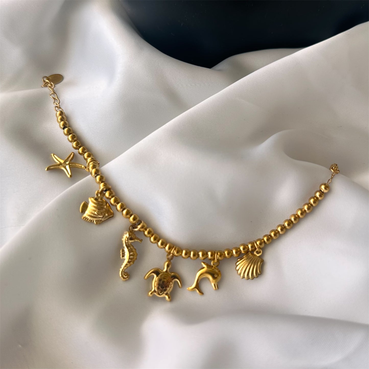 Bracciale in acciaio con sfere di 6 mm e ciondoli Marini sonaglio