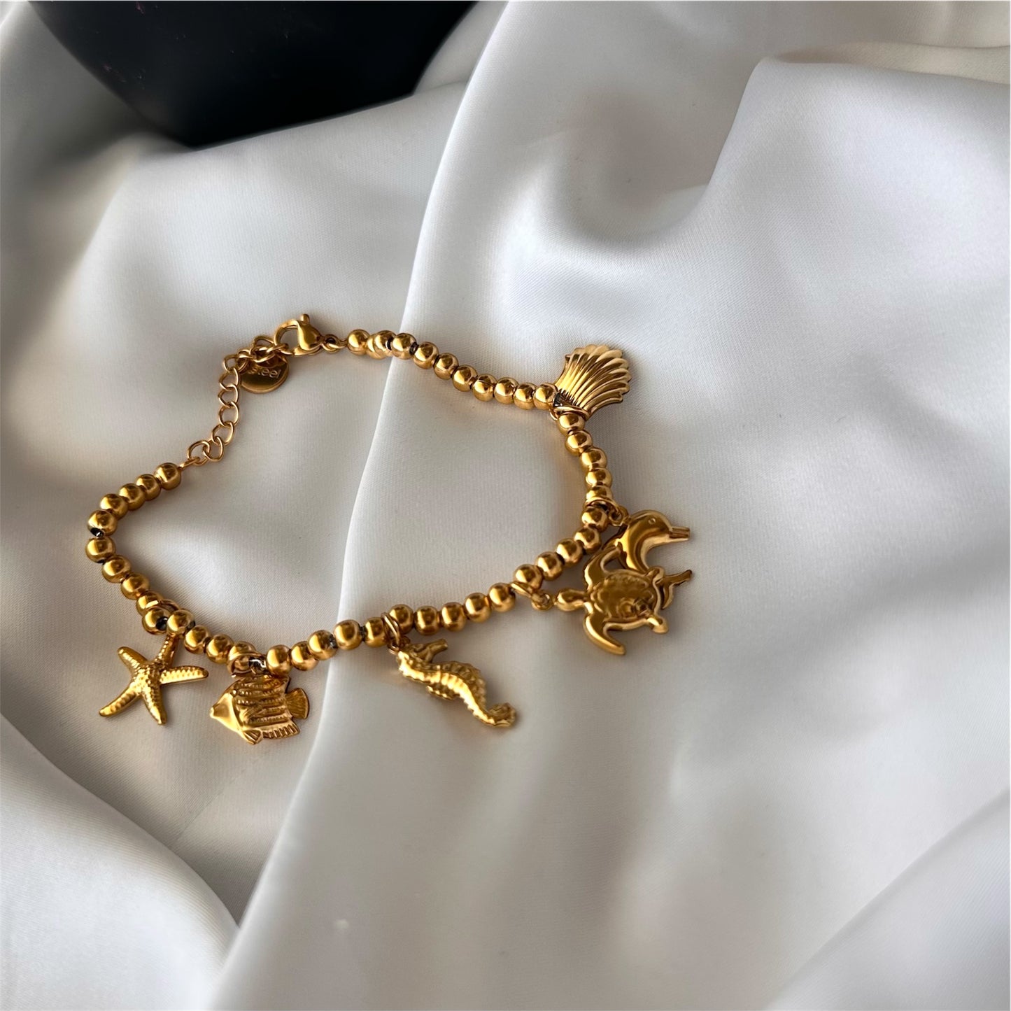 Bracciale in acciaio con sfere di 6 mm e ciondoli Marini sonaglio