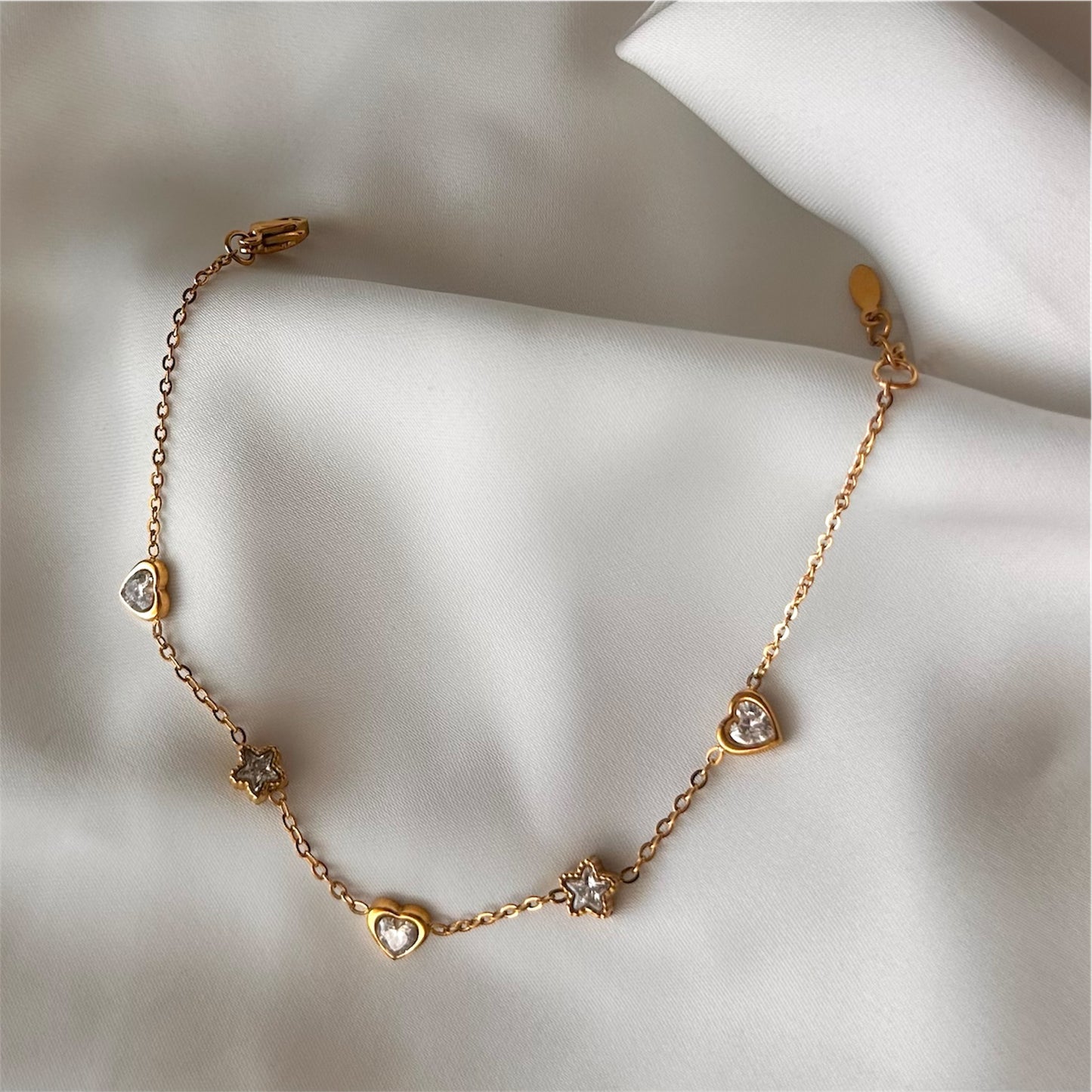 Bracciale "Cuore e Stelle" in acciaio con charms e cristallo