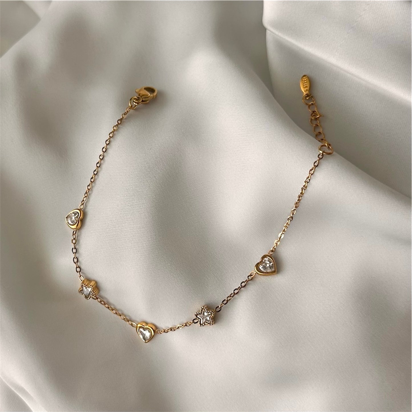 Bracciale "Cuore e Stelle" in acciaio con charms e cristallo