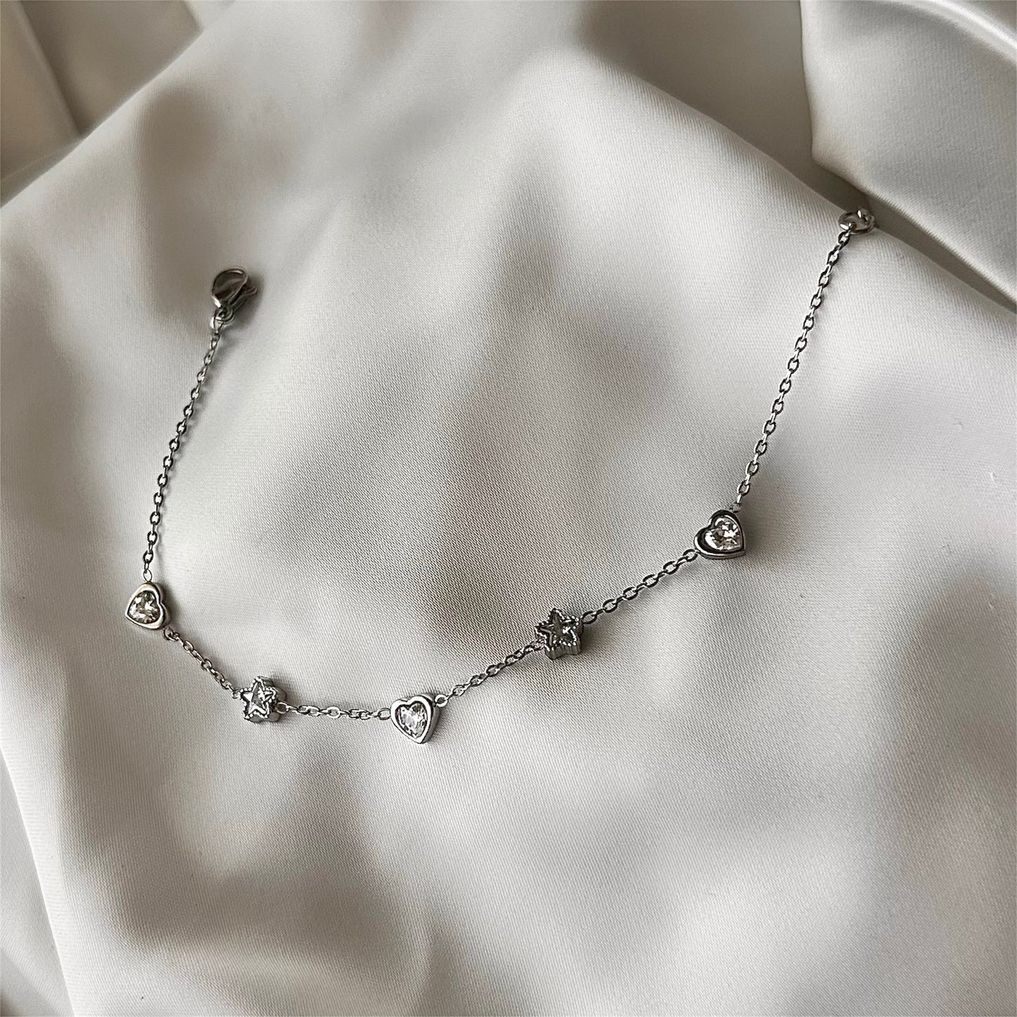 Bracciale "Cuore e Stelle" in acciaio con charms e cristallo