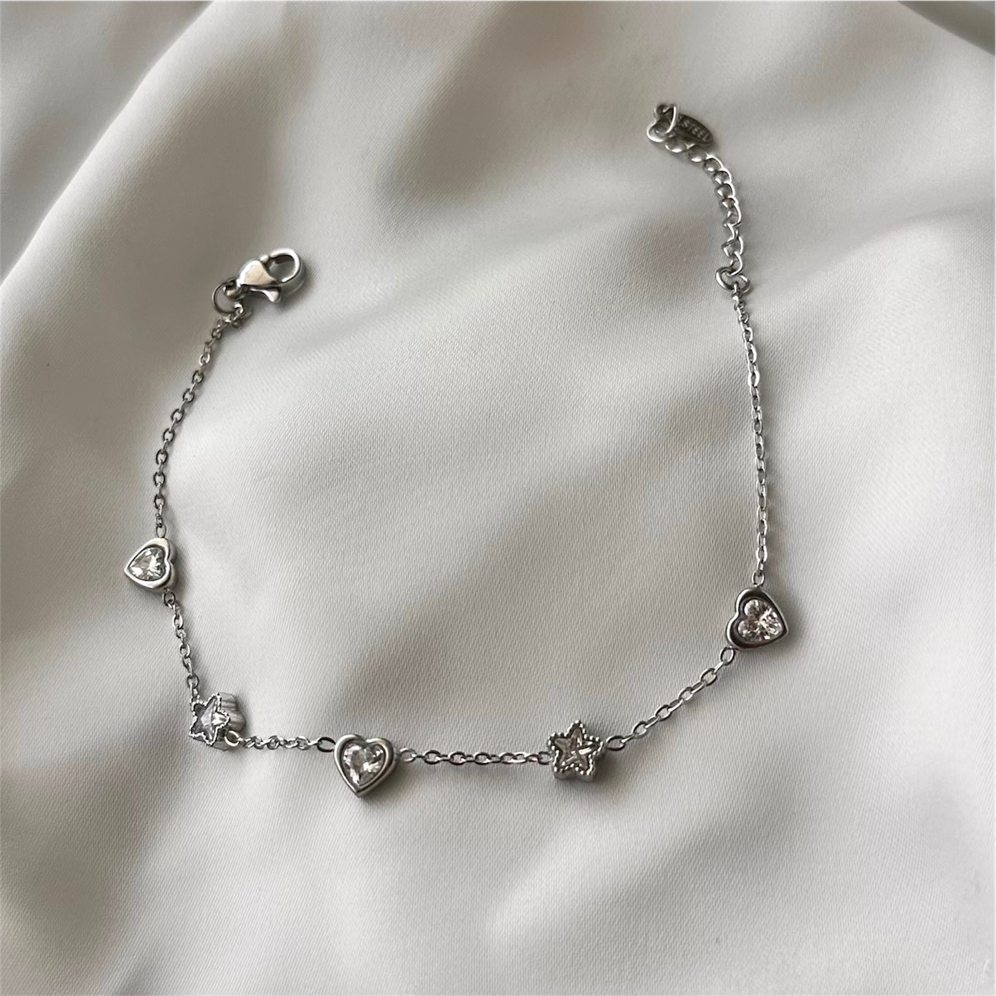 Bracciale "Cuore e Stelle" in acciaio con charms e cristallo